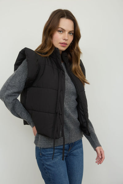 playful pop flutter sleeve bow detail puffer vest | black