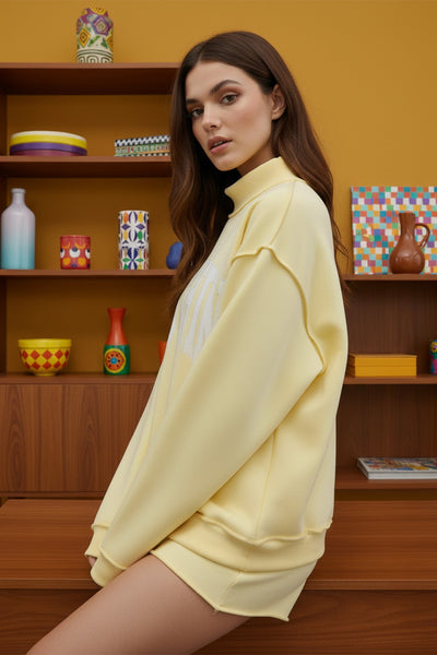 'mother' embroidered mockneck sweater | butter yellow