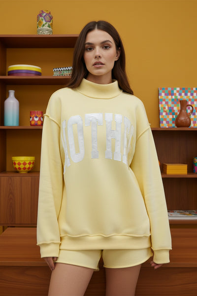 'mother' embroidered mockneck sweater | butter yellow