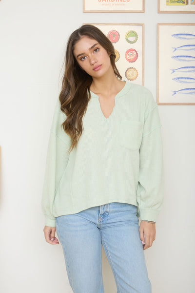 isn't that something raw edge knit top | light green