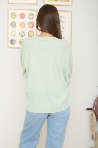 isn't that something raw edge knit top | light green
