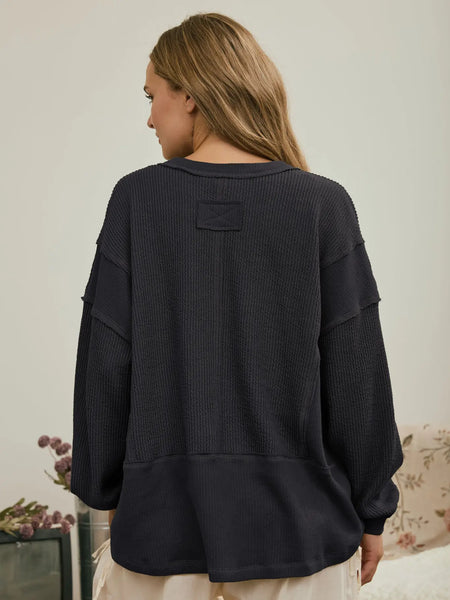 isn't that something raw edge knit top | charcoal