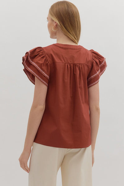 simply sophisticated embroidered flutter sleeve top | brick
