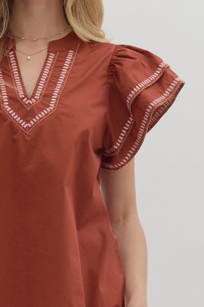 simply sophisticated embroidered flutter sleeve top | brick